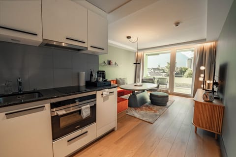 Mate Apartment 460 | Private kitchen | Full-size fridge, microwave, oven, stovetop