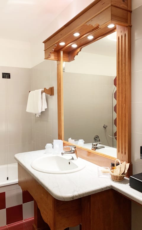 Shower, free toiletries, hair dryer, slippers