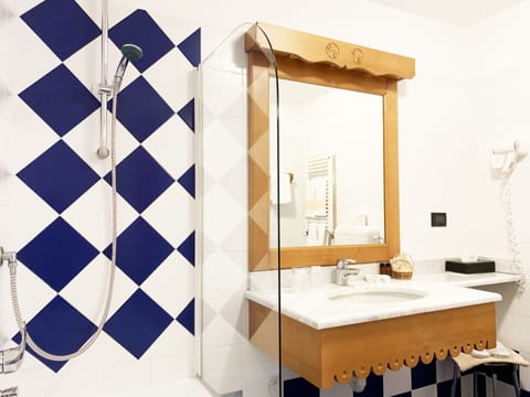 Shower, free toiletries, hair dryer, slippers