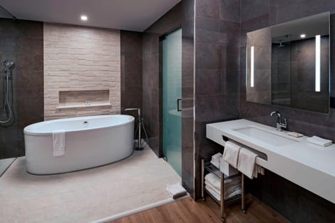 Suite, 1 King Bed | Bathroom | Shower, free toiletries, hair dryer, bathrobes