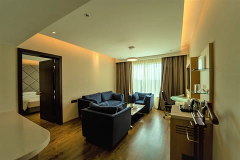 Suite, 1 bedroom | Living area | 42-inch LED TV with satellite channels, TV, offices