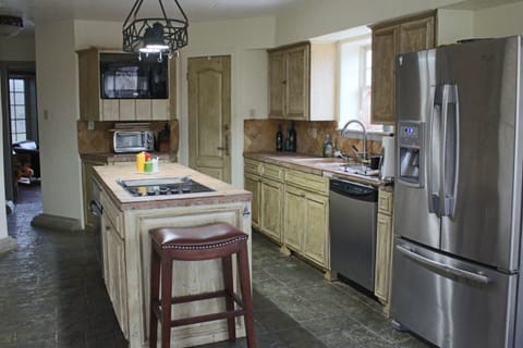 Plenty of space in the kitchen with all the necessary appliances, pots and pans