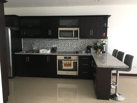 Family House, Multiple Beds, Non Smoking | Private kitchen | Full-size fridge, microwave, oven, stovetop