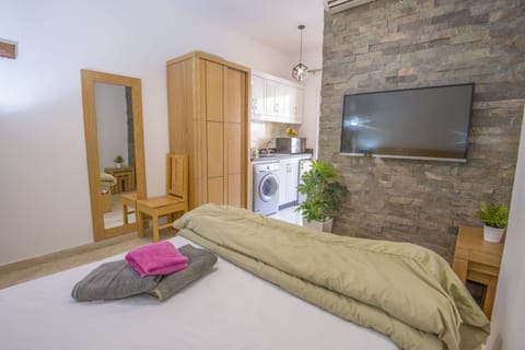 Pool View, Balcony, Kitchenette, Washing Machine | Tiba Resort E4 | Living area | Flat-screen TV