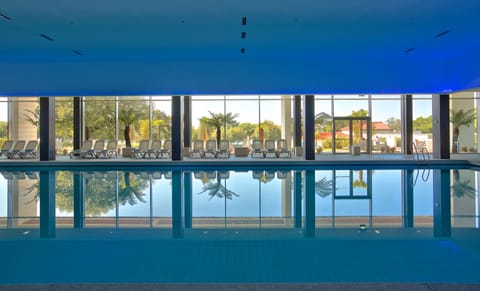 Indoor pool, 2 outdoor pools, open 8 AM to 9 PM, pool umbrellas