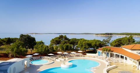 Indoor pool, 2 outdoor pools, open 8 AM to 9 PM, pool umbrellas