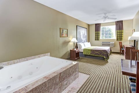 Suite, 1 King Bed, Non Smoking, Jetted Tub | Memory foam beds, blackout drapes, iron/ironing board, rollaway beds