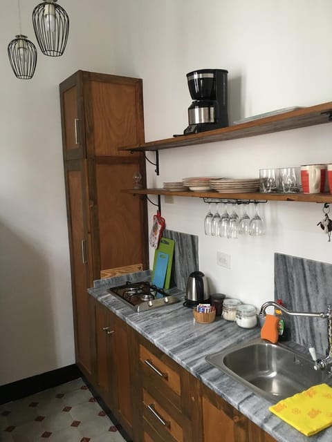 Full-size fridge, microwave, stovetop, coffee/tea maker