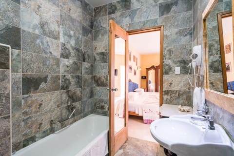 Deluxe Suite, 2 Queen Beds, Non Smoking | Deep soaking bathtub