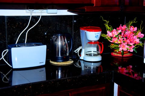 3-Bedroom Villa | Shared kitchen | Full-size fridge, microwave, rice cooker, cookware/dishes/utensils