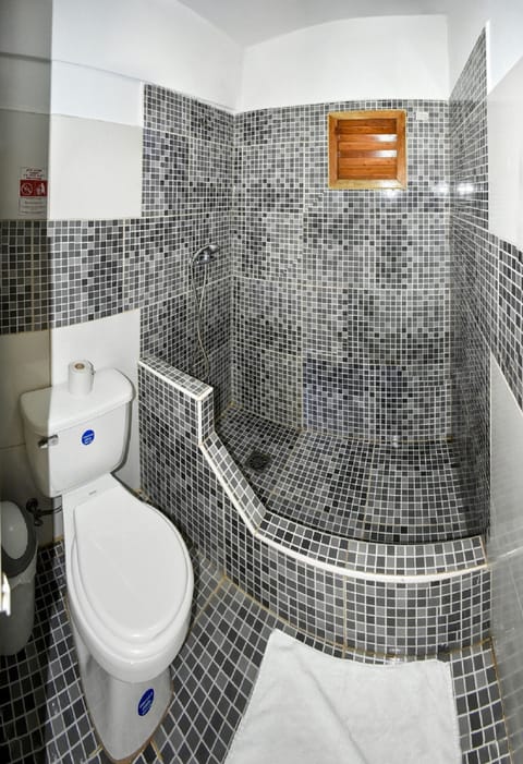 Family Quadruple Room, City View | Bathroom | Shower, rainfall showerhead, designer toiletries, hair dryer