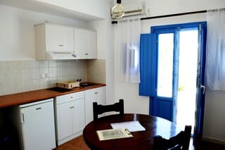 Suite, Pool View | Private kitchen | Fridge, coffee/tea maker