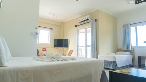 Deluxe Quadruple Room | In-room safe, blackout drapes, iron/ironing board, free WiFi