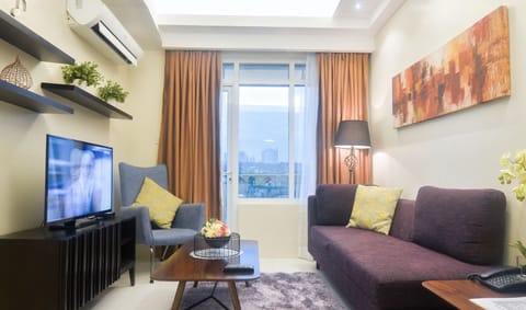 One Bedroom Suite | Living area | Flat-screen TV