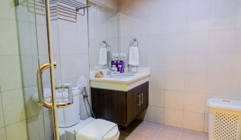 One Bedroom Suite | Bathroom | Shower, free toiletries, slippers, towels