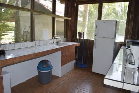 Bungalow, Multiple Beds | Private kitchen | Fridge, microwave, stovetop, cookware/dishes/utensils