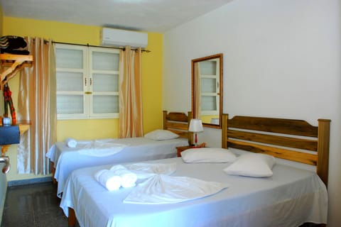 Economy Triple Room, Multiple Beds, Non Smoking | Minibar, in-room safe, free WiFi, bed sheets