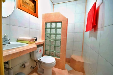 Basic Quadruple Room, 2 Double Beds | Bathroom | Shower, hair dryer, towels