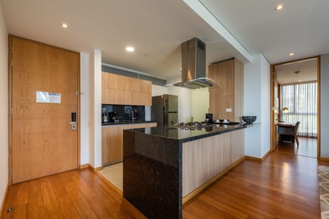 Deluxe Room, Multiple Beds | Private kitchen | Fridge