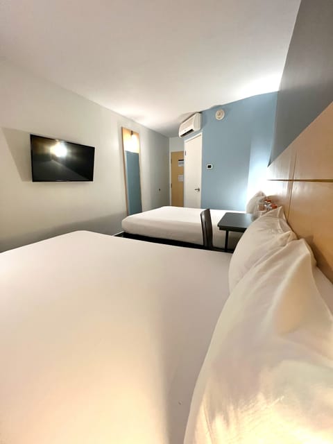 Double Room, 2 Double Beds | Bathroom | Eco-friendly toiletries, hair dryer, towels