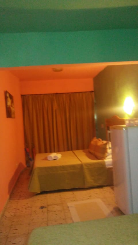 Economy Double Room, 2 Queen Beds, Non Smoking | Bathroom | Shower, rainfall showerhead, free toiletries, towels