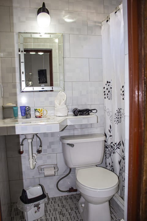 Luxury Room, 1 Bedroom, Smoking, Balcony | Bathroom | Shower, rainfall showerhead, free toiletries, hair dryer