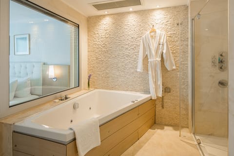 Rainfall showerhead, eco-friendly toiletries, hair dryer, bathrobes