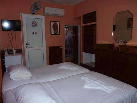 Double or Twin Room | Minibar, in-room safe, iron/ironing board, bed sheets