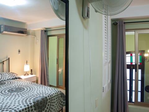 Double Room | Minibar, in-room safe, iron/ironing board, bed sheets