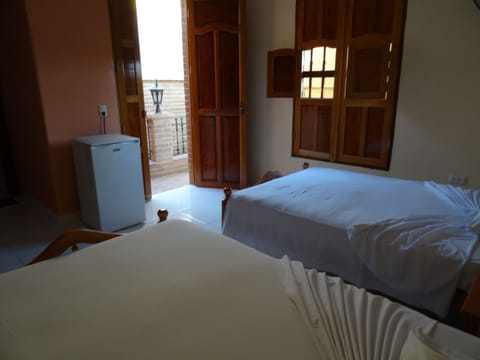 Double or Twin Room | Minibar, in-room safe, iron/ironing board, bed sheets