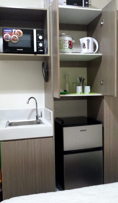 Full-size fridge, microwave, rice cooker, cookware/dishes/utensils