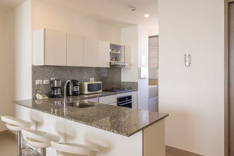 Luxury Condo, Multiple Beds, Non Smoking | Private kitchen | Full-size fridge, microwave, oven, stovetop