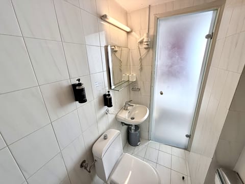 Economy Double Room, 1 Double or 2 Twin Beds | Bathroom | Shower, hair dryer, towels