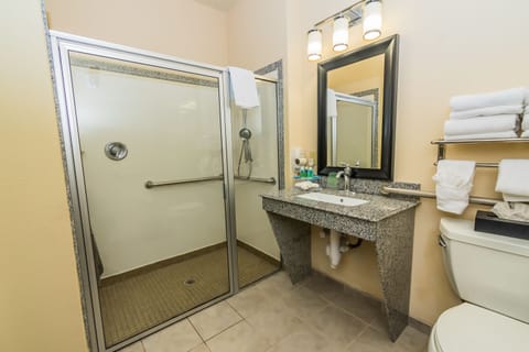 Room, 1 King Bed, Accessible (Communications, Mobil, Roll-In Shower) | Bathroom | Deep soaking tub, free toiletries, hair dryer, towels