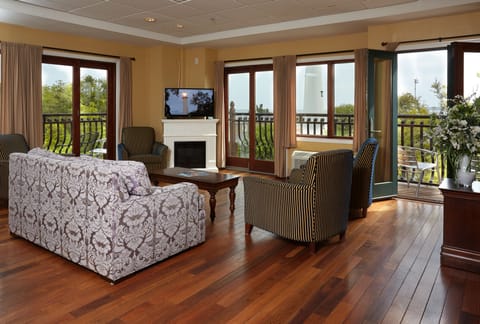 Presidential Suite, 2 Bedrooms, Balcony | Living room | 27-inch TV with cable channels