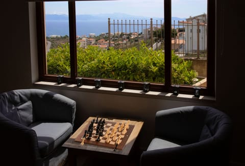 The main living-room - play chess, enjoy your drink or bothwith a nice sea-view