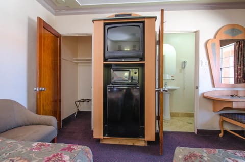 Standard Double Room, 1 Bedroom | Living area | 32-inch flat-screen TV with satellite channels, TV