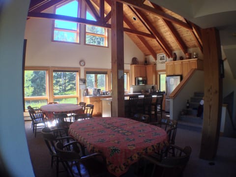Dining area and well equipped kitchen with island for prep and entertaining
