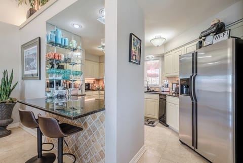 Kitchen with bar passthrough. All stainless appliances. 