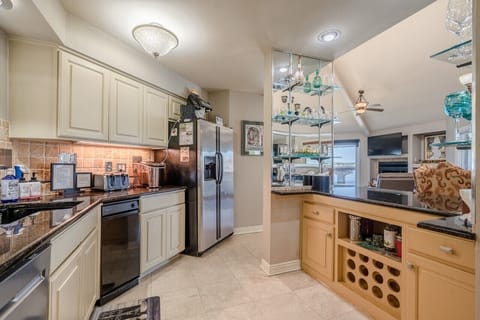 Open kitchen with dry bar area.  Wine for guests. 