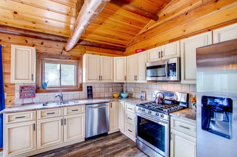 Custom kitchen with granite and stainless steel appliances