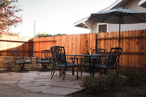 Backyard. Table for six plus extra sitting areas.