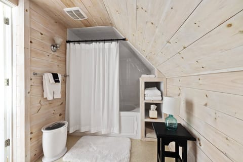 Treehouse Room | Bathroom | Designer toiletries, hair dryer, bathrobes, slippers