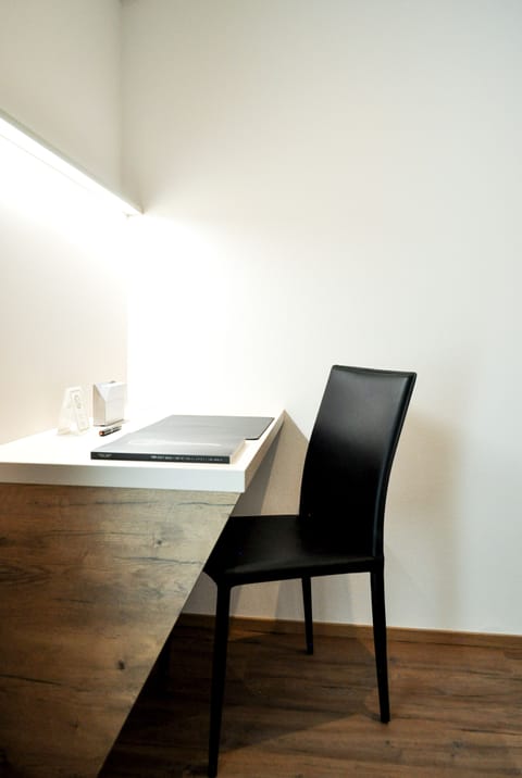 Desk, laptop workspace, blackout drapes, soundproofing