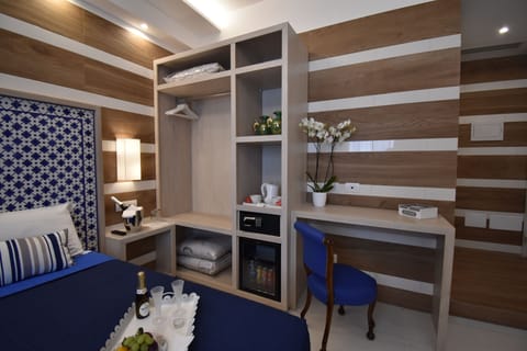 Classic Triple Room | Minibar, in-room safe, desk, blackout drapes