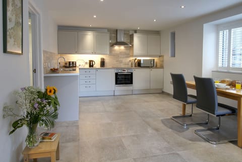 Open plan kitchen - diner in Lloc Llo holiday cottage