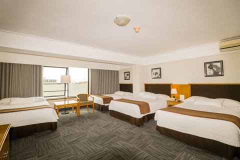 Standard Quadruple Room | Down comforters, minibar, in-room safe, desk