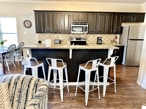 Plenty of seating: 2 tables seat 10 + bar seating for 4!