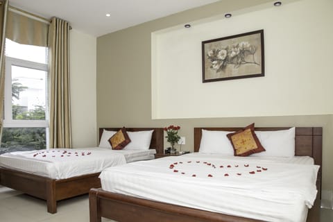 Deluxe Room, 2 Queen Beds | Minibar, desk, iron/ironing board, free WiFi