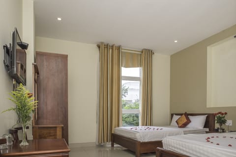 Deluxe Room, 2 Queen Beds | Minibar, desk, iron/ironing board, free WiFi